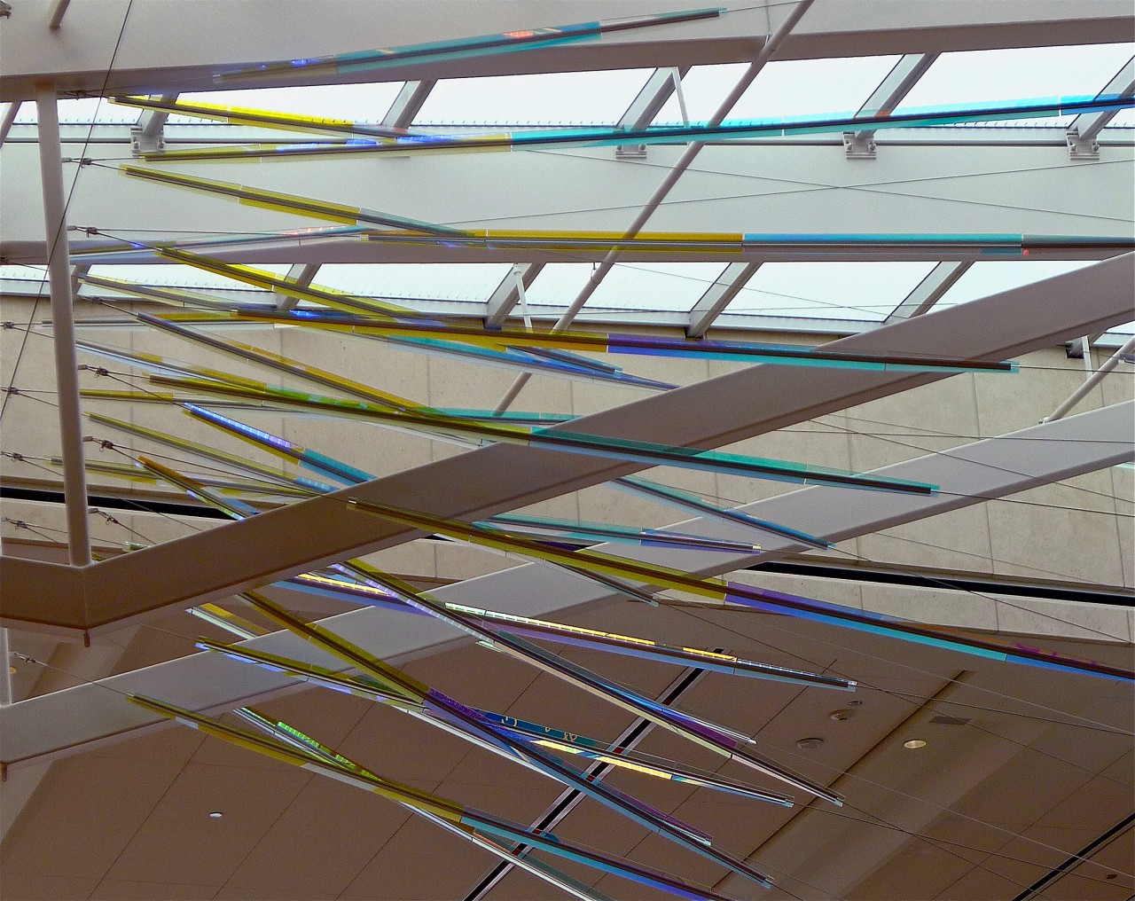 Close up view of Ed Carpenter’s McCarran airport skylight art inner layer of cable-mounted glass panels whose colors and reflections transform themselves dramatically from various angles. | Image 4 | Ed Carpenter, Artist