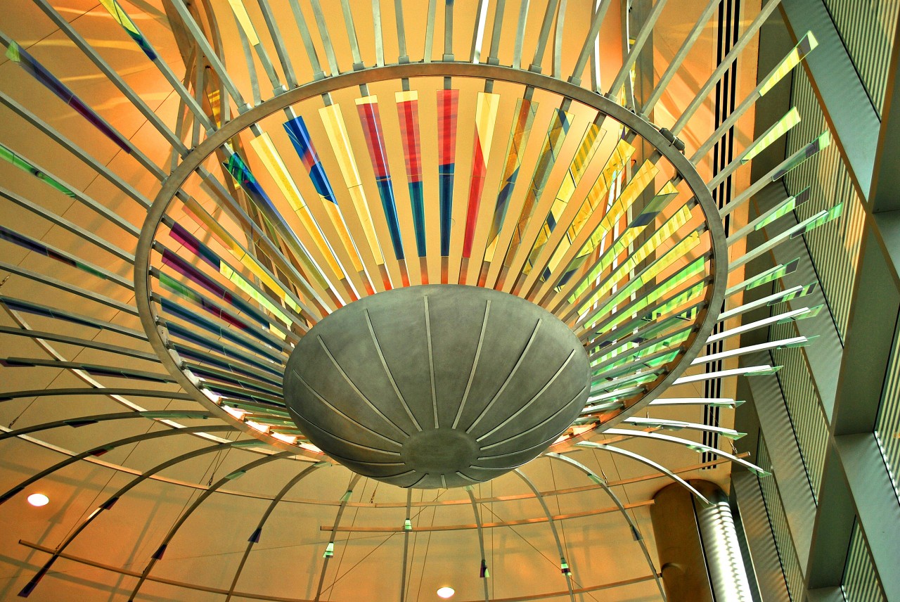 Ed Carpenter’s Radius suspended ceiling sculpture emanates outward through the Ann Arbor Justice Center lobby with brilliant dichroic glass elements. | Image 4 | Ed Carpenter, Artist