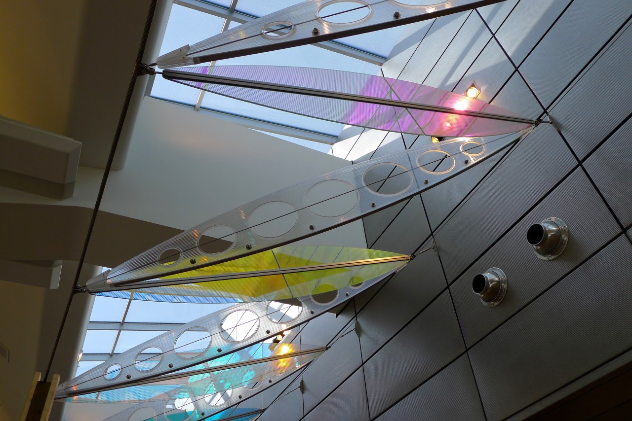 Ed Carpenter’s Wichita Dwight D. Eisenhower National Airport signature sculpture Aloft delights travelers with colorful laminated safety dichroic glass above. | Image 13 | Ed Carpenter, Artist
