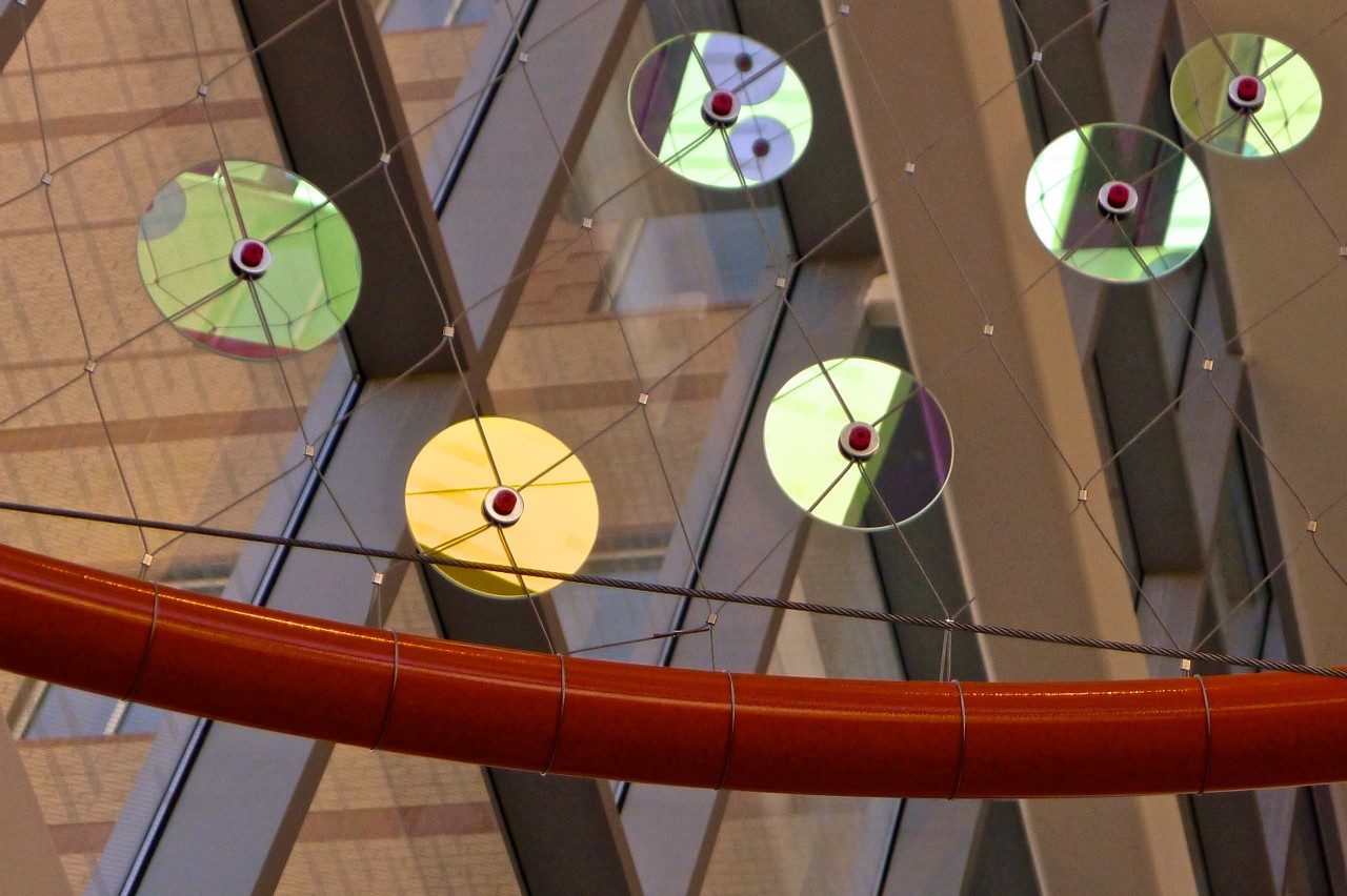 Close up of the dichroic rounds used in Ed Carpenter’s Foxglove suspended glass art lobby. | Image 8 | Ed Carpenter, Artist