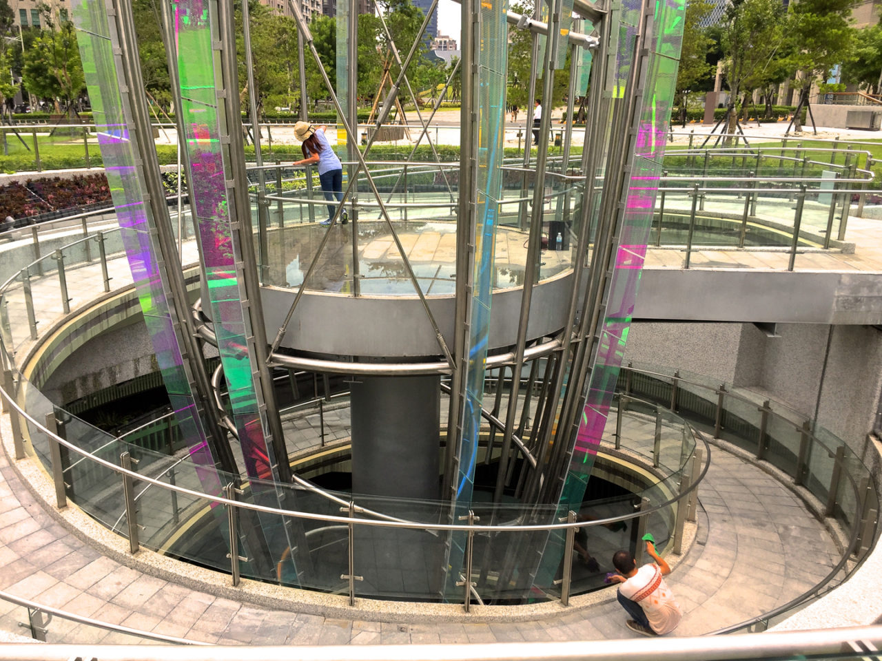 Taichung, Taiwan Civic Center monumental sculpture: Stainless Steel and Laminated Dichroic Glass. Crocus emerges from two levels of parking below the parks, surrounds a viewing platform, and unfolds upward like an enormous blossom. | Image 7 | Ed Carpenter, Artist