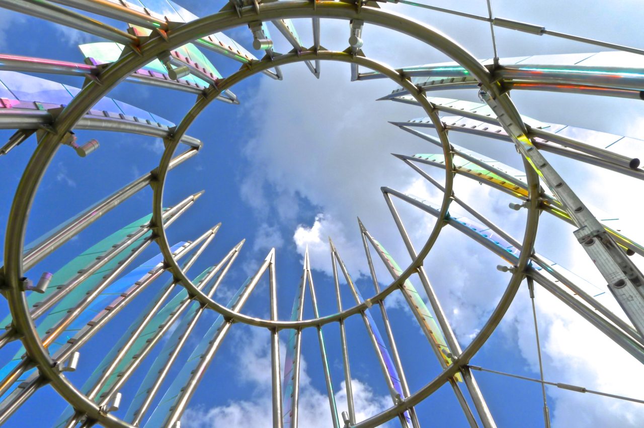 Taichung, Taiwan Civic Center monumental sculpture: Stainless Steel and Laminated Dichroic Glass. View of the sculpture, Crocus, looking up from below, showing details of the stainless steel and laminated glass materials. | Image 15 | Ed Carpenter, Artist